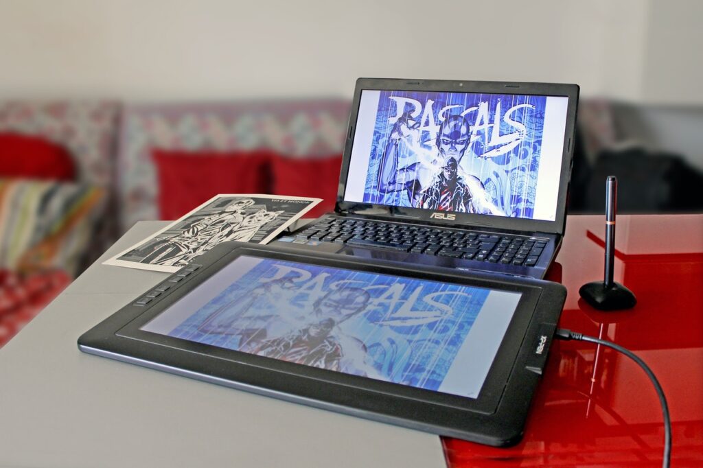 A digital pen display graphics tablet connected to a laptop